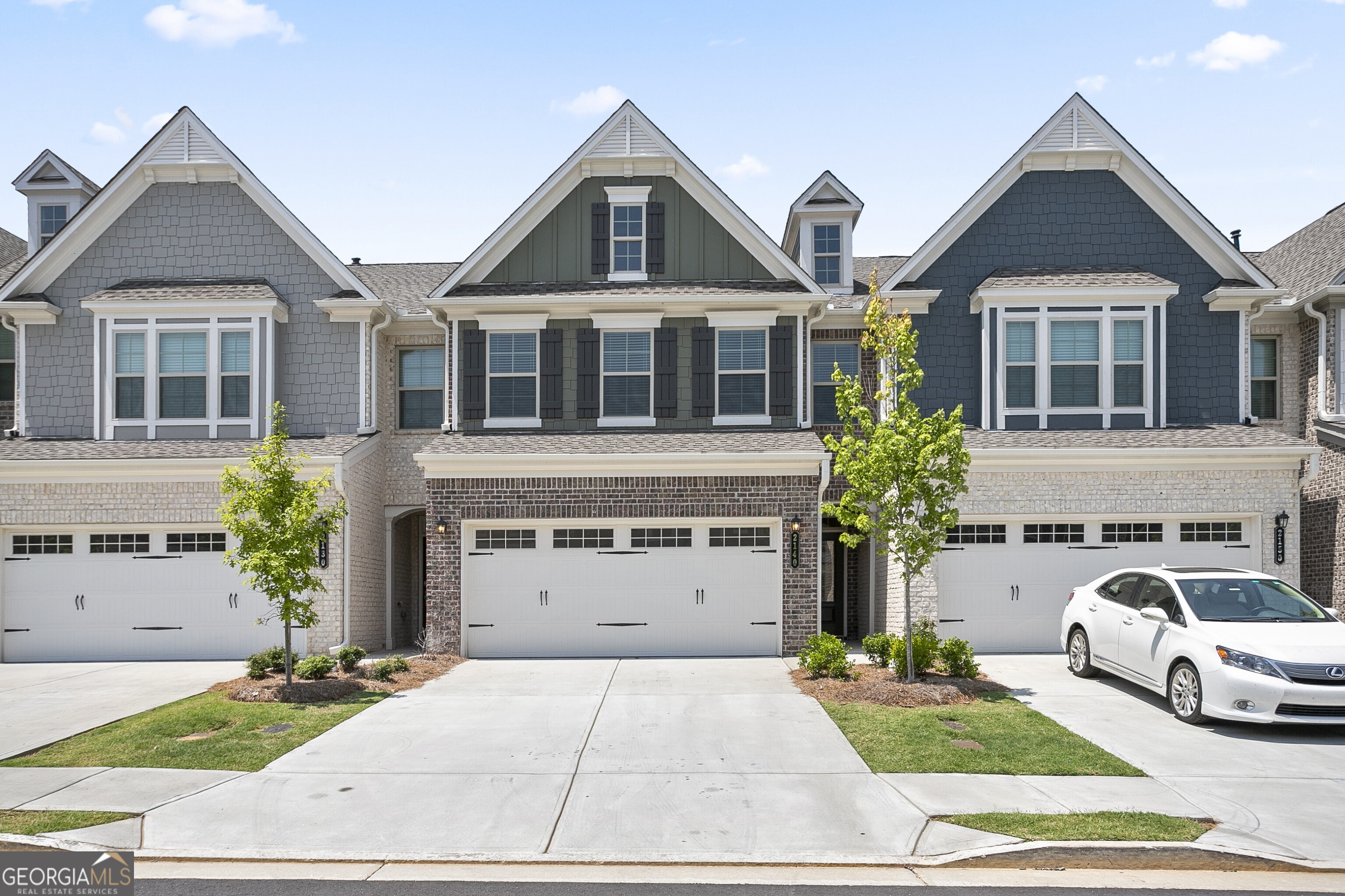 a front view of a house with a yard