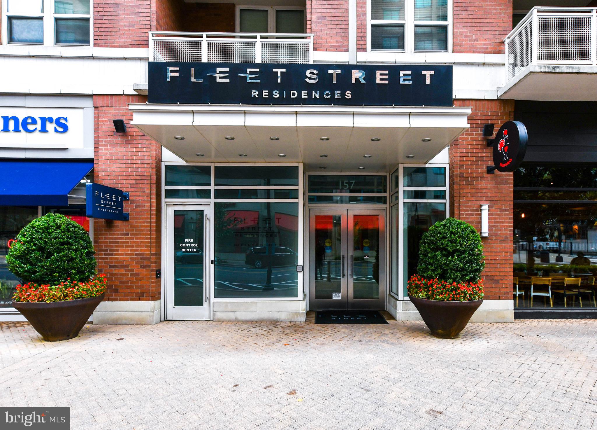 a view of a building with potted plants