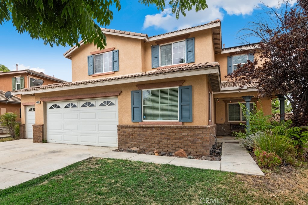 front view of a house with a yard