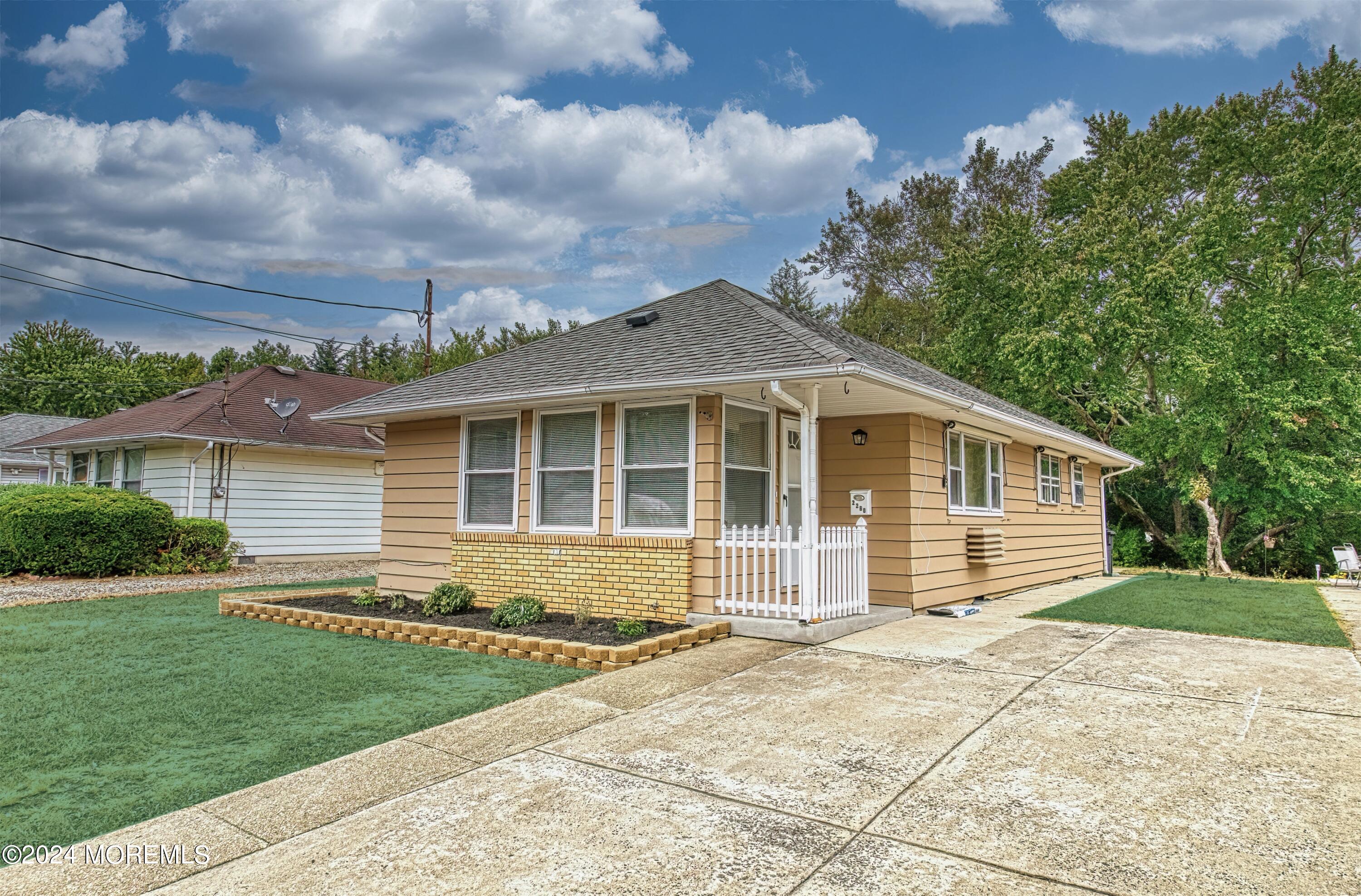 front view of a house and a yard