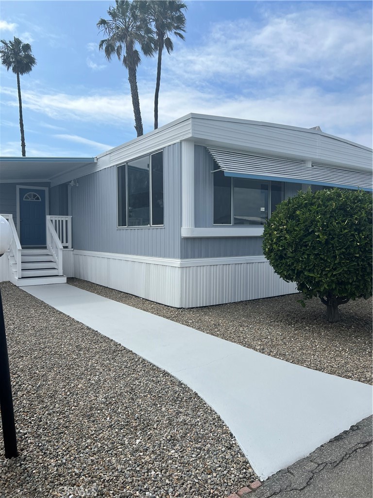 a view of a house with a yard and garage