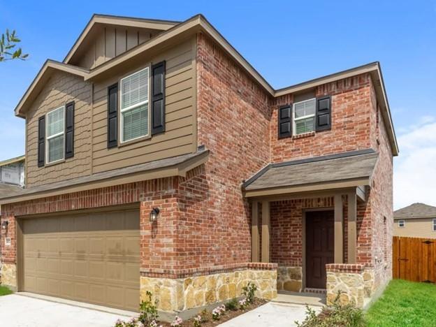 a front view of a house with garage