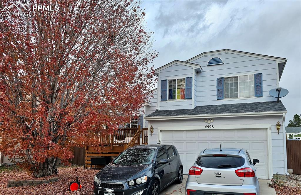 a front view of a house with parking