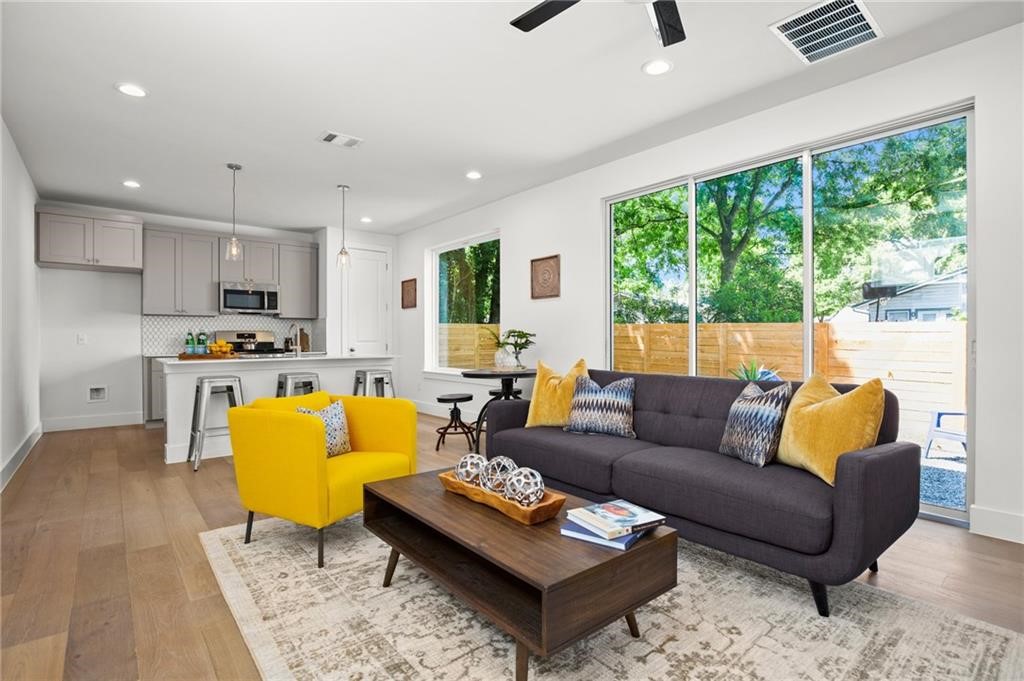 a living room with furniture and a large window