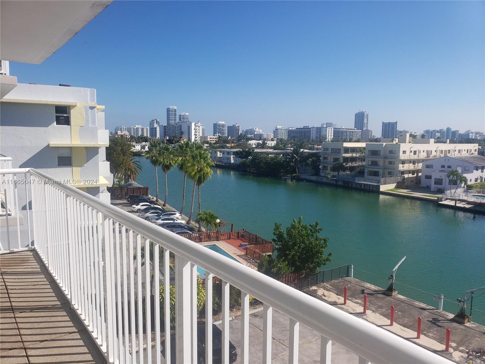 a view of a balcony with city