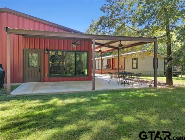 a view of a backyard with sitting area