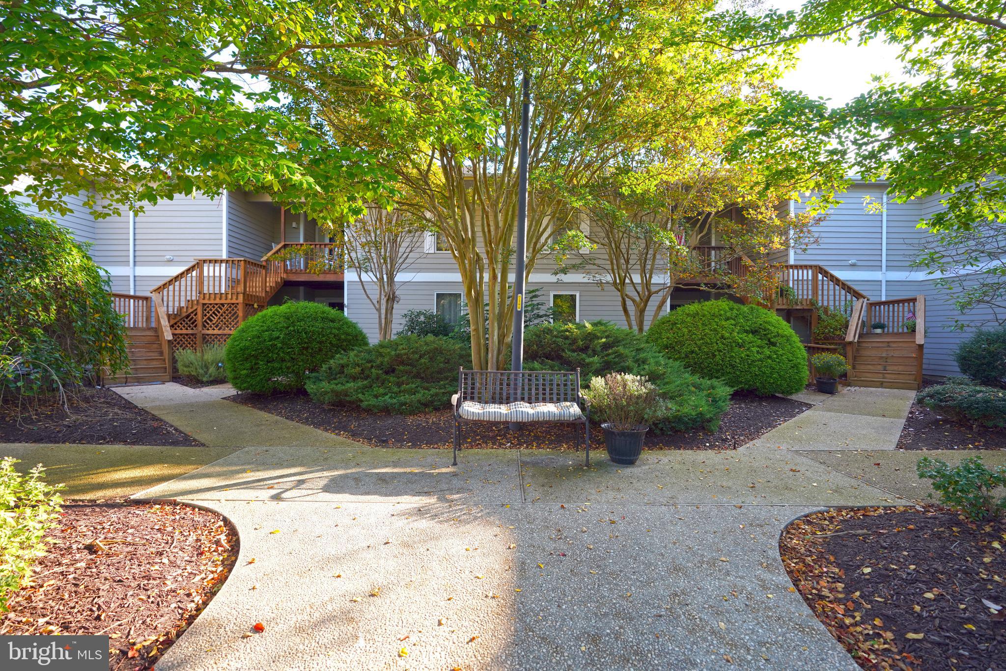 a view of a backyard with sitting area