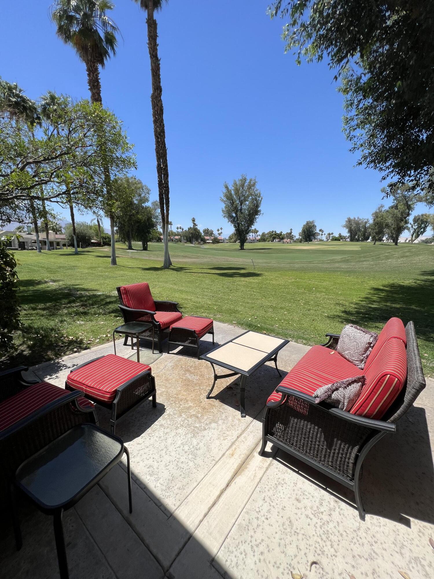 a view of a yard with furniture