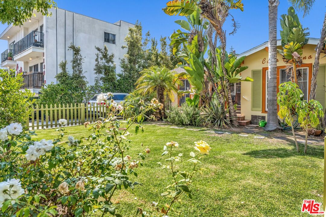 a view of a garden with a building