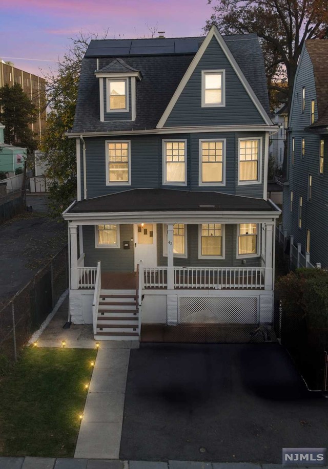 a front view of a house with yard