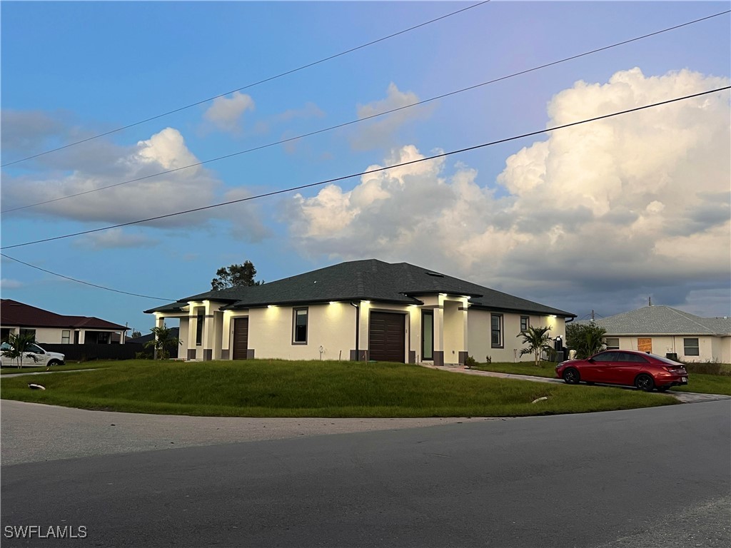 a front view of a house with a yard