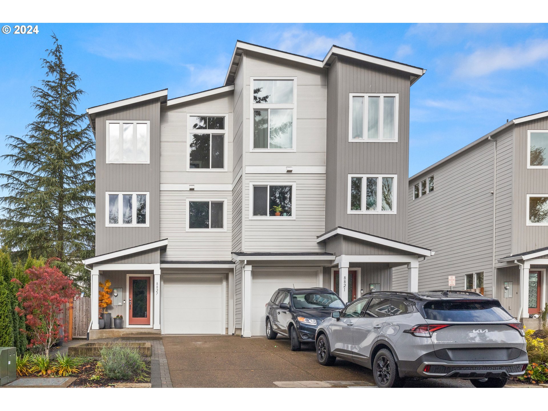 a front view of a house with parking space