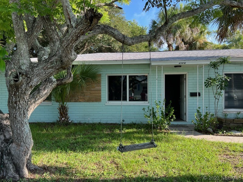 front view of a house with a yard