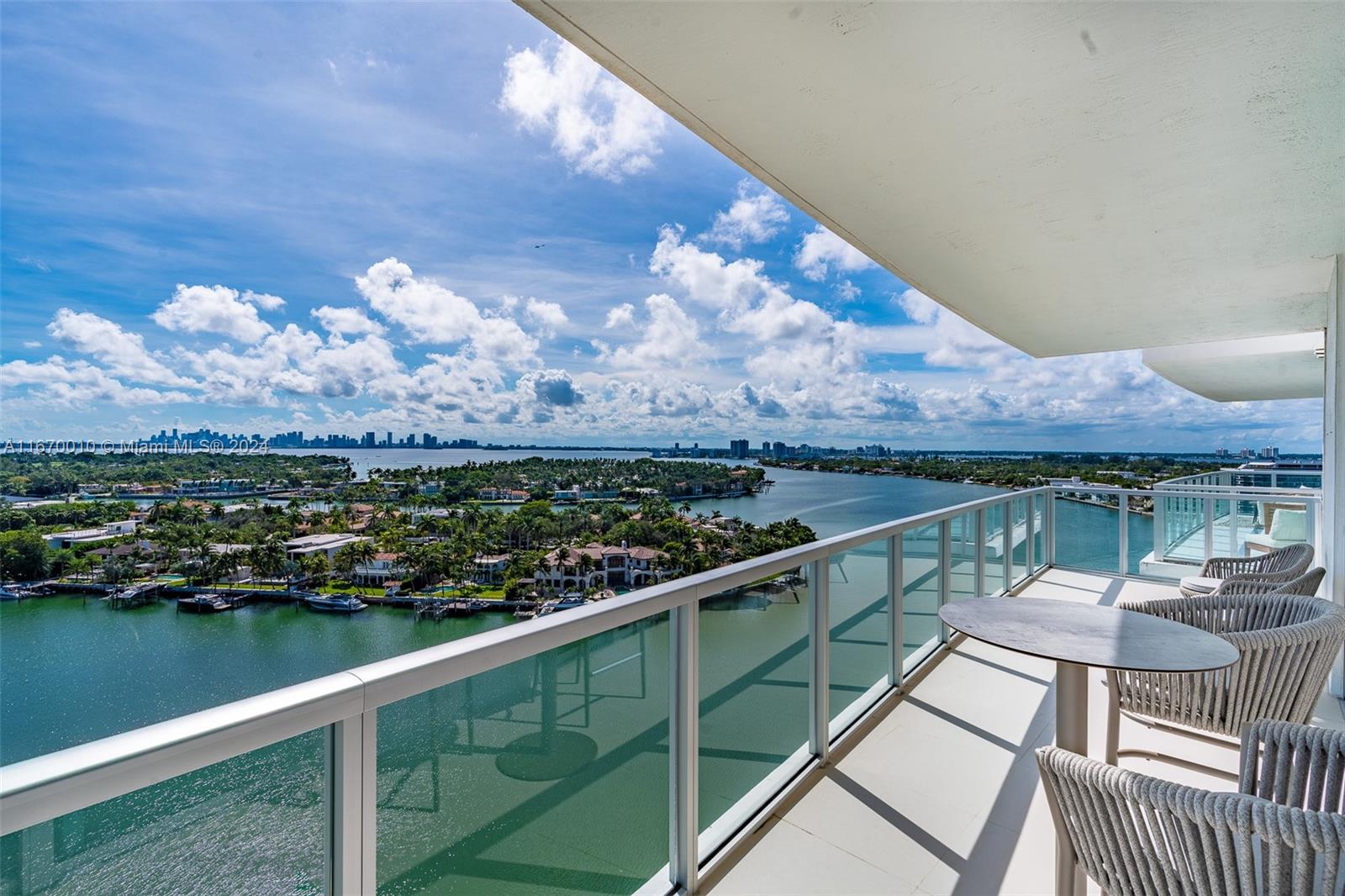 a view of a balcony with two chairs