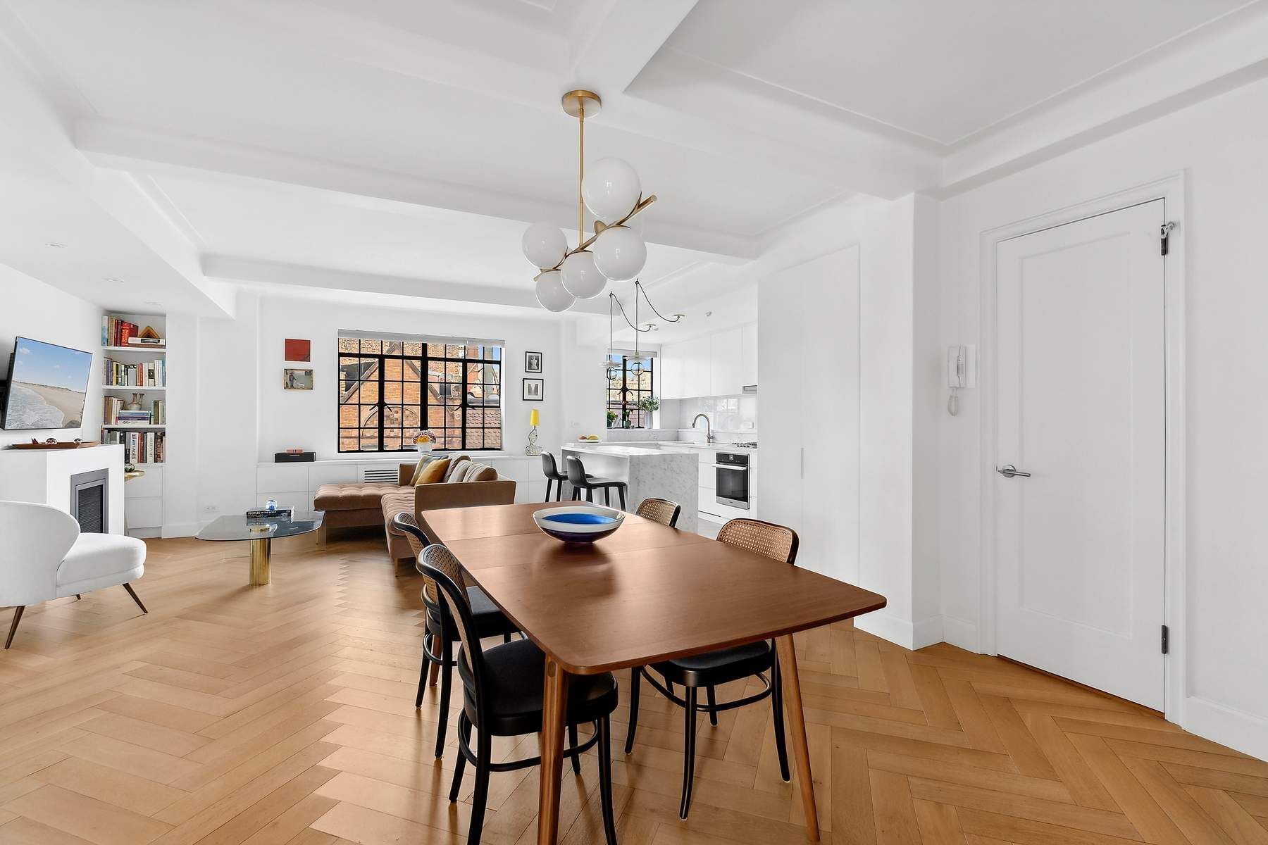 a view of a dining room with furniture and wooden floor