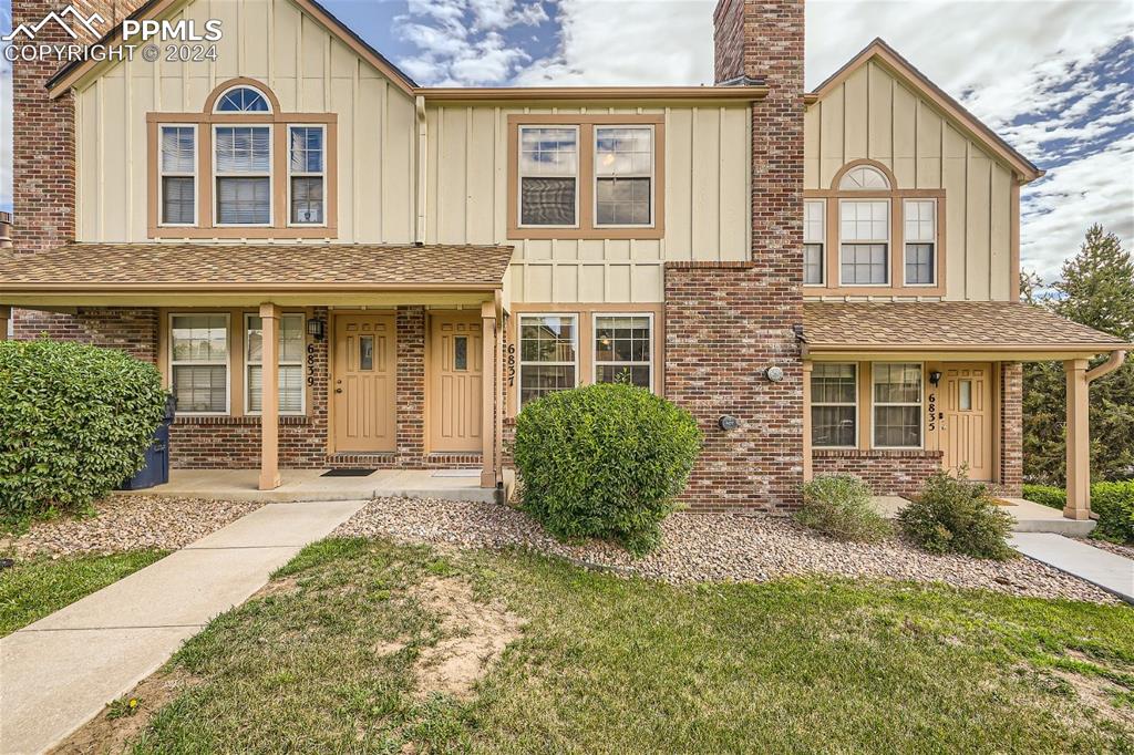 front view of a house with a yard