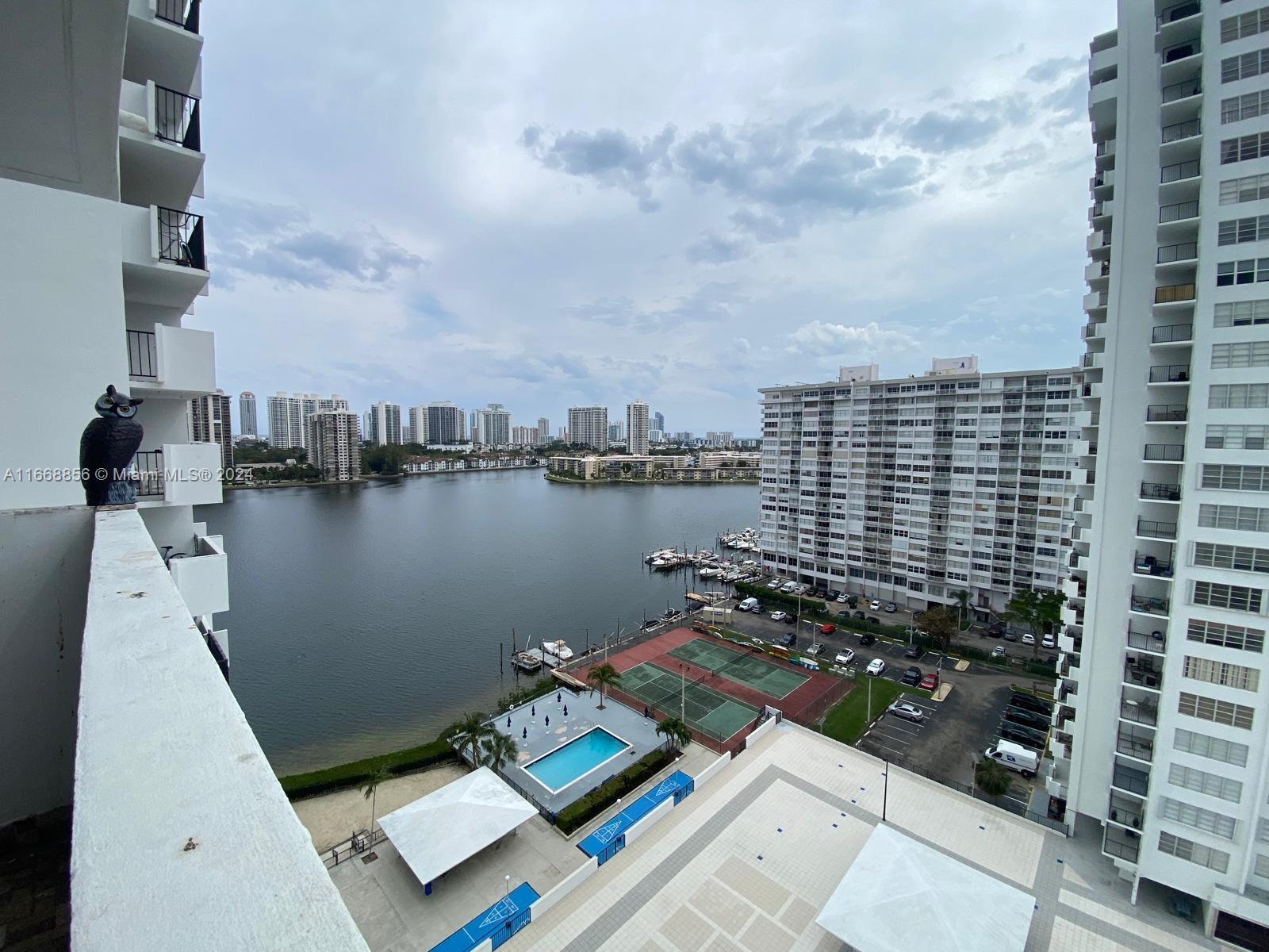 a view of a lake with tall buildings