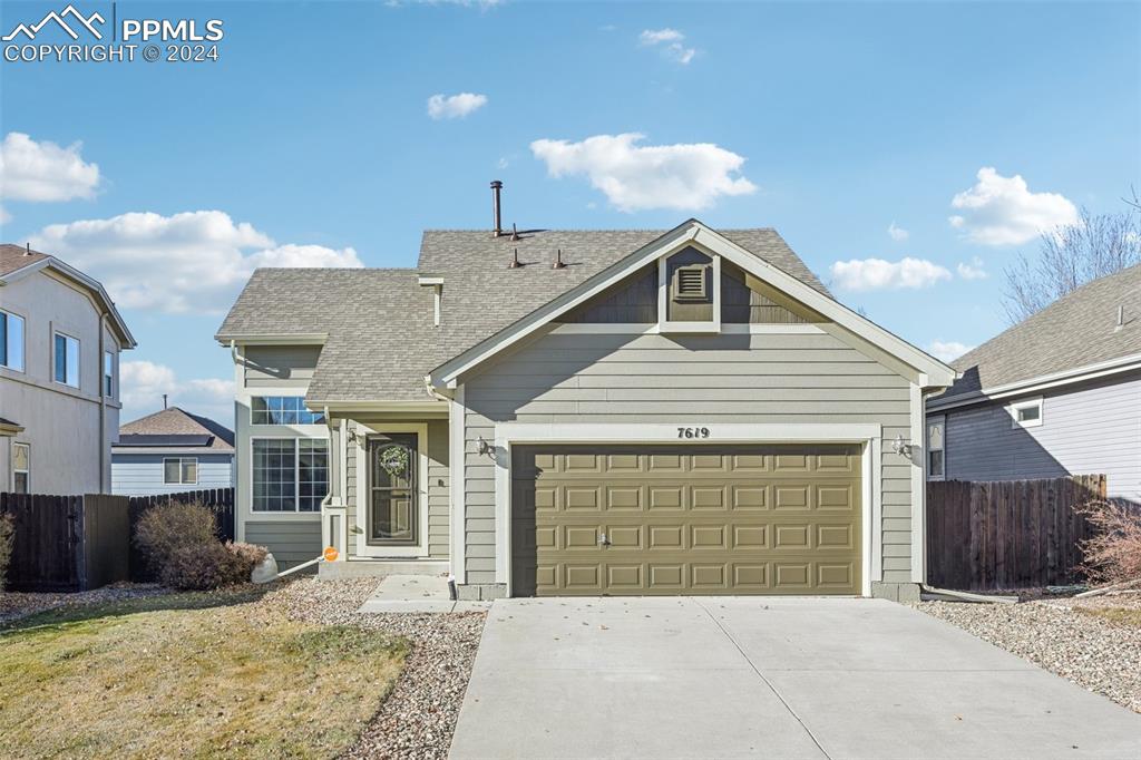 a front view of a house with a garage