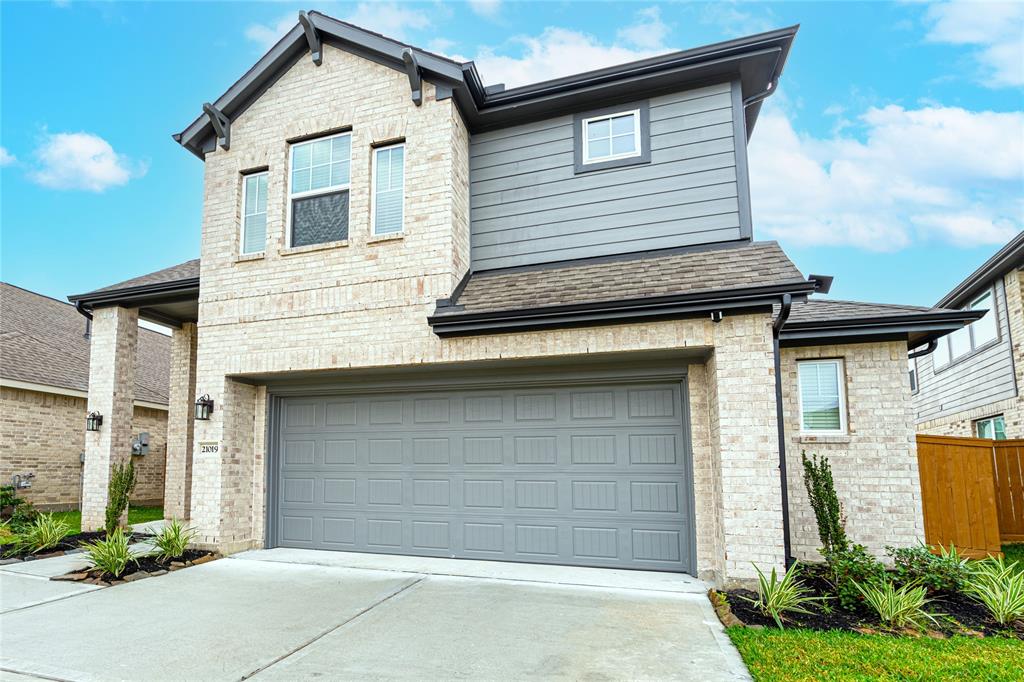 a front view of a house with a garage