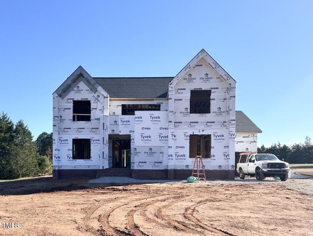 a front view of a house with yard