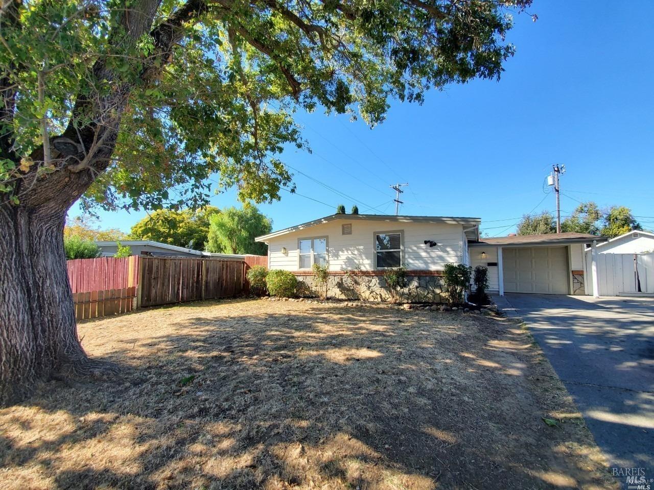 a view of a backyard with parked area