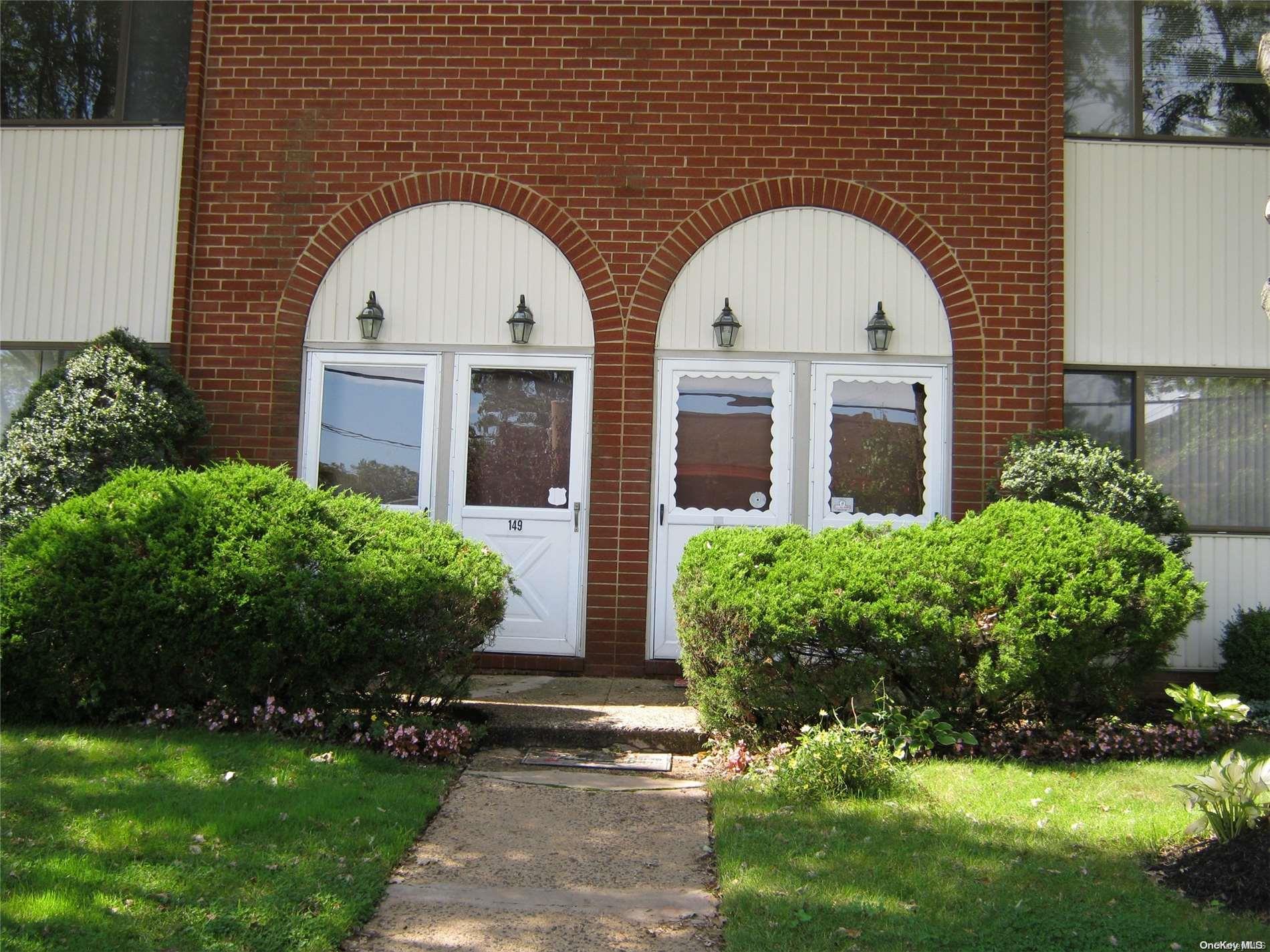 a view of front door and yard