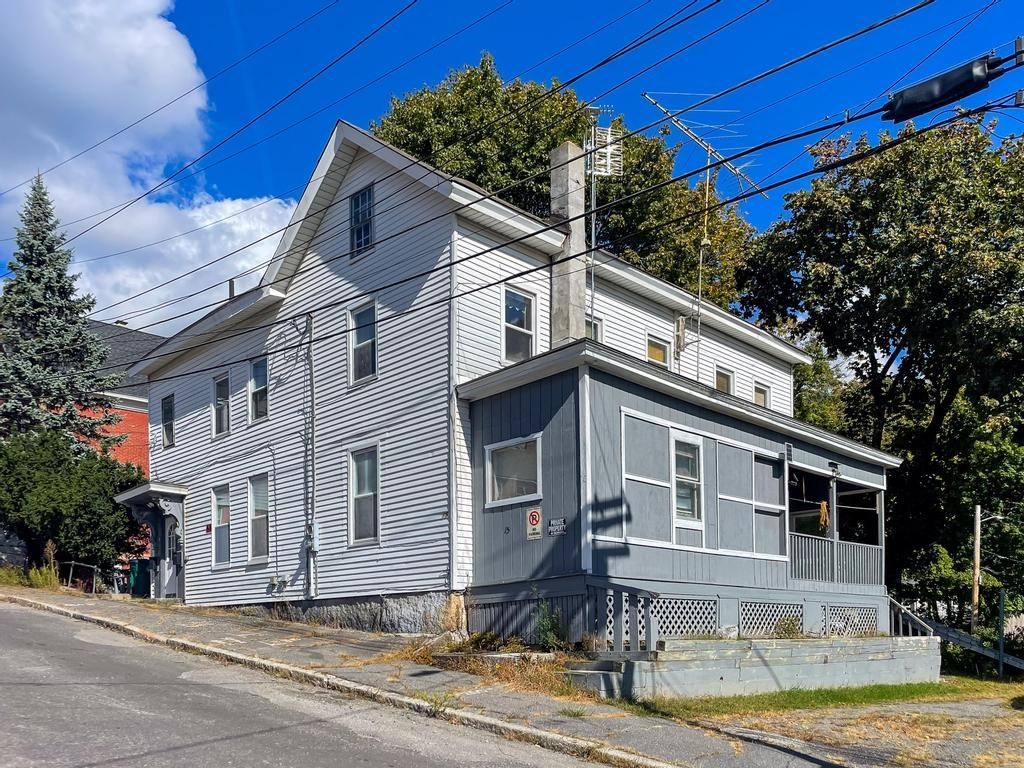 a front view of a house with a yard