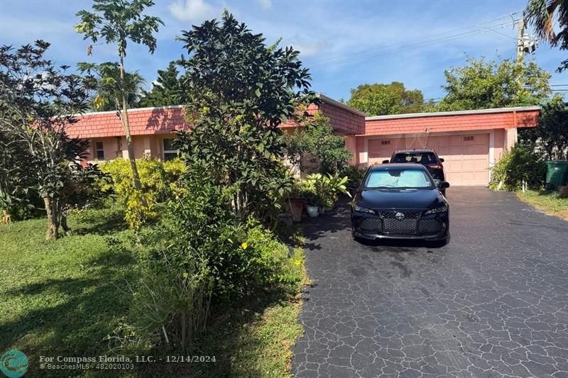 a car parked in front of a house