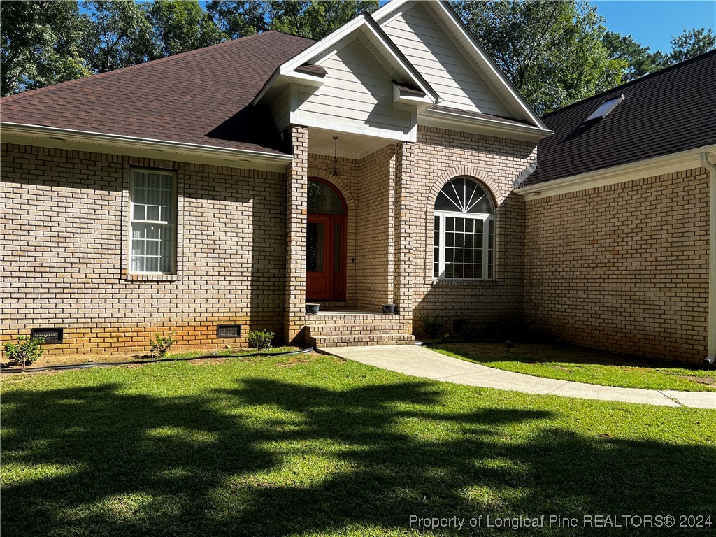 a front view of a house with a yard