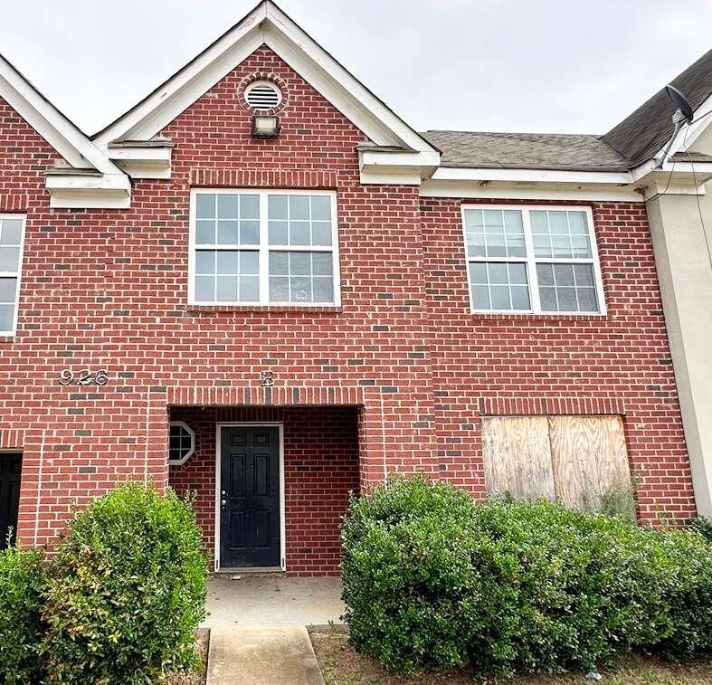 a front view of a house with a garage