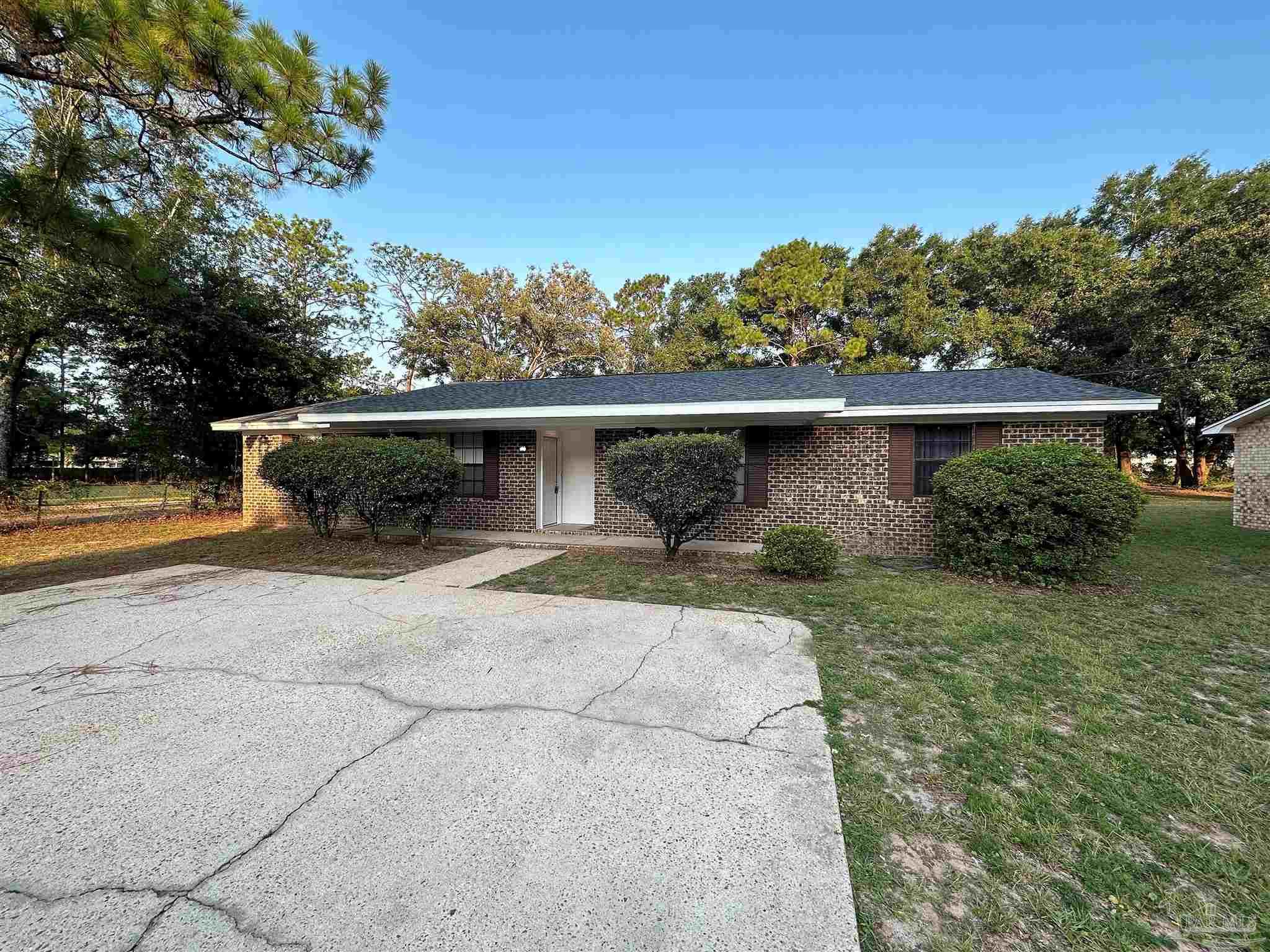 front view of a house with a yard