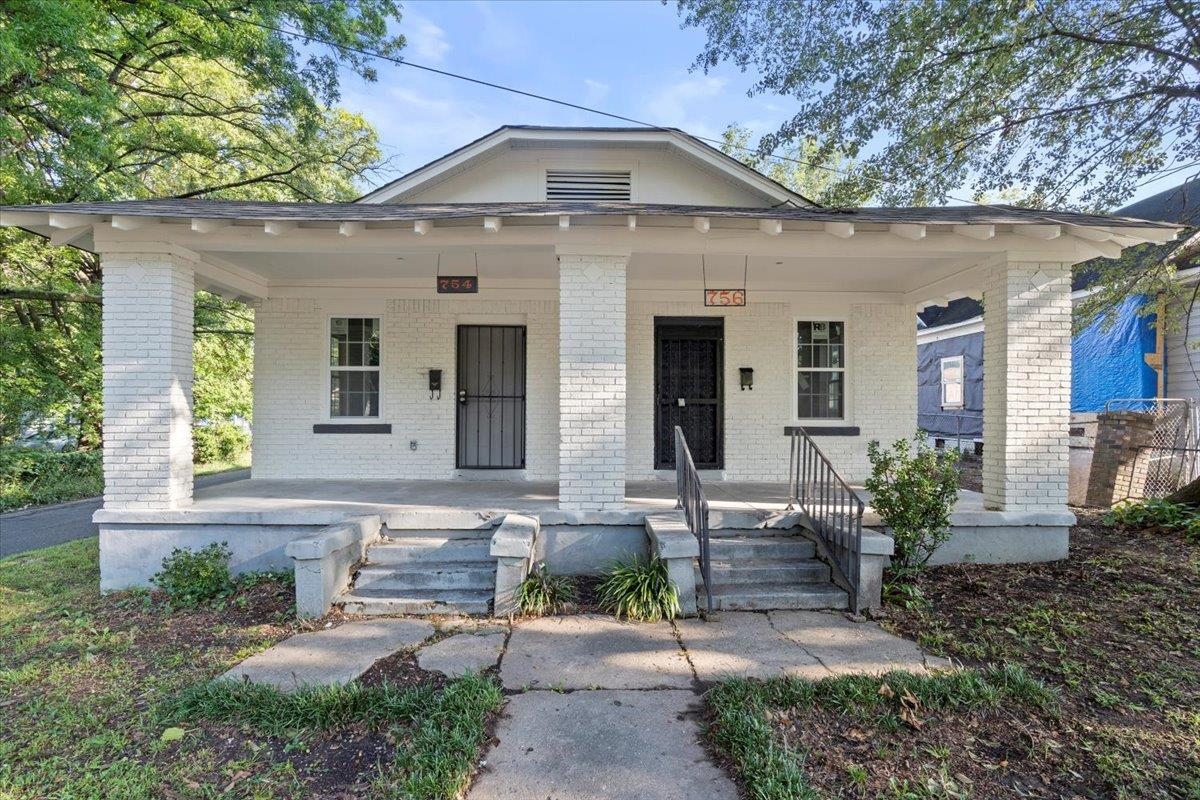 Bungalow-style house with a porch