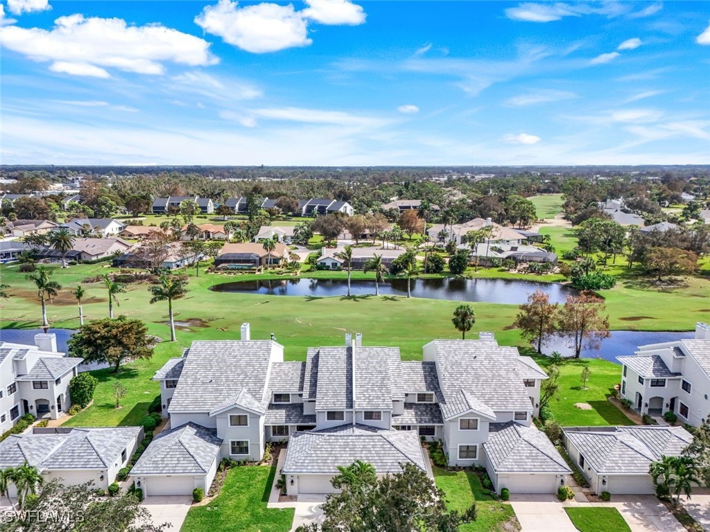 an aerial view of a house with a lake view