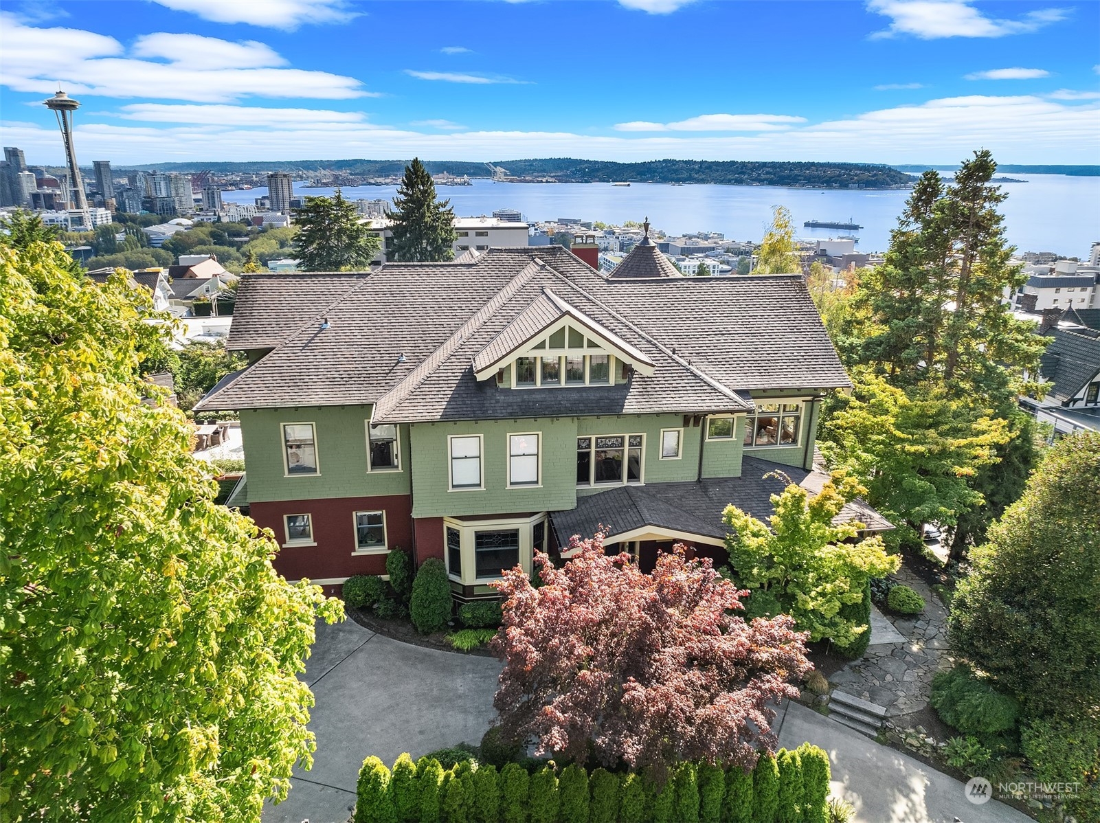 a aerial view of a house next to a yard