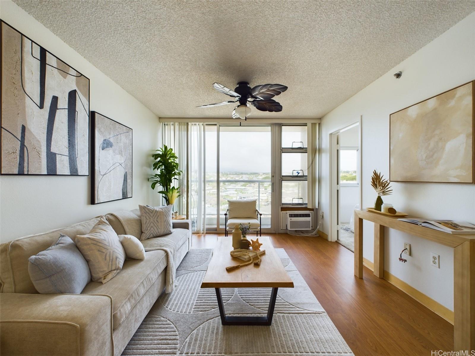 a living room with furniture large window and a table