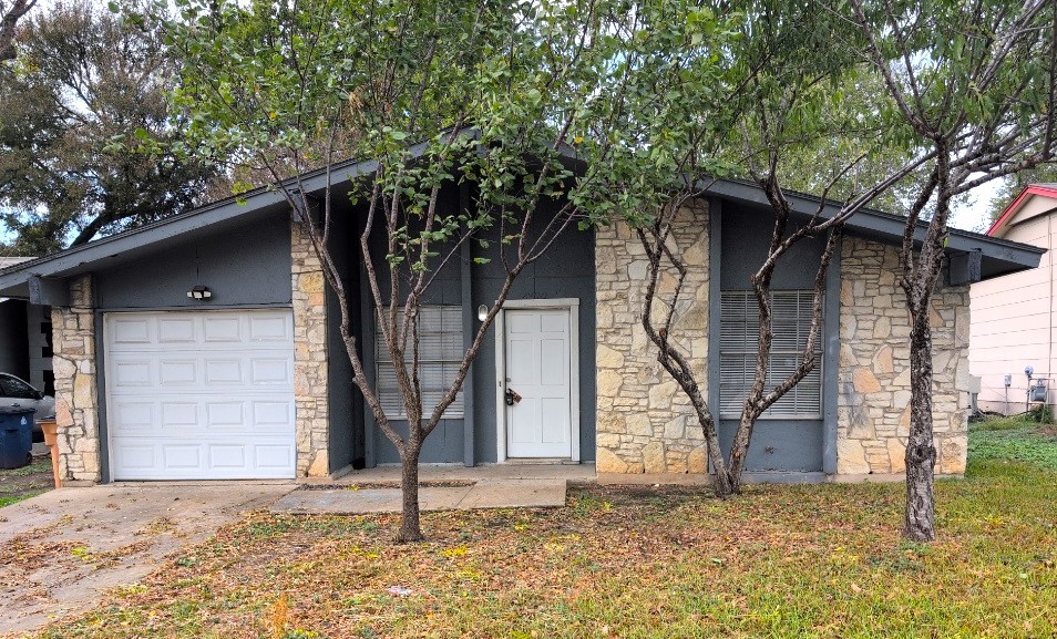 a house with trees in front of it