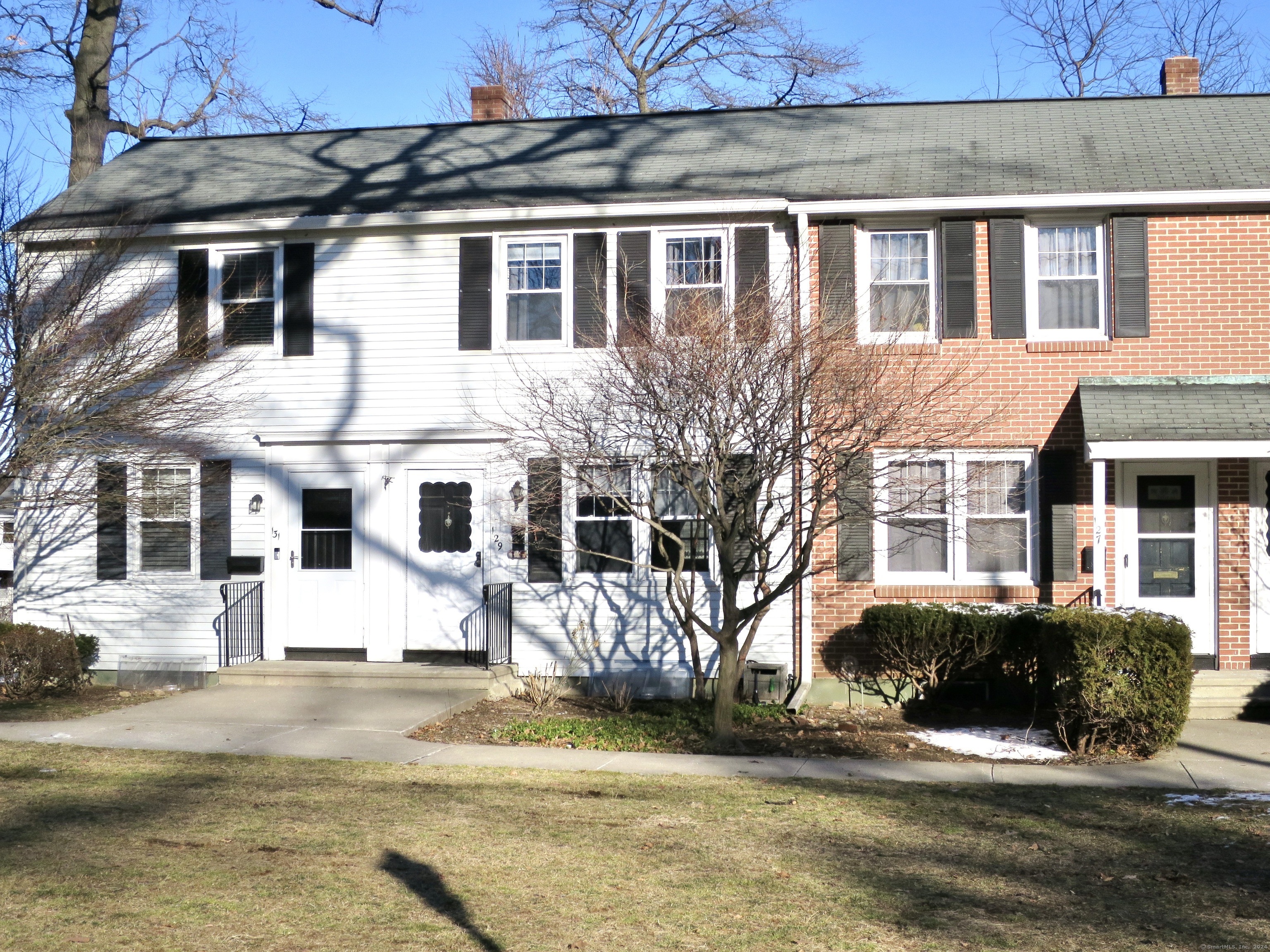 a front view of a house with a yard