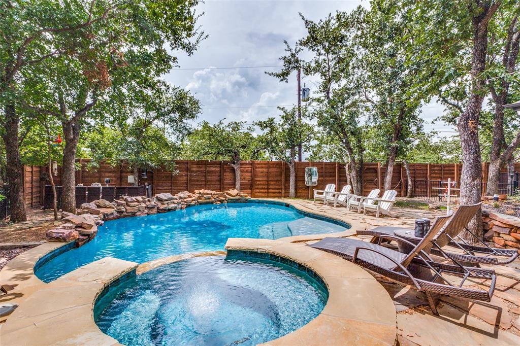 swimming pool view with a seating space