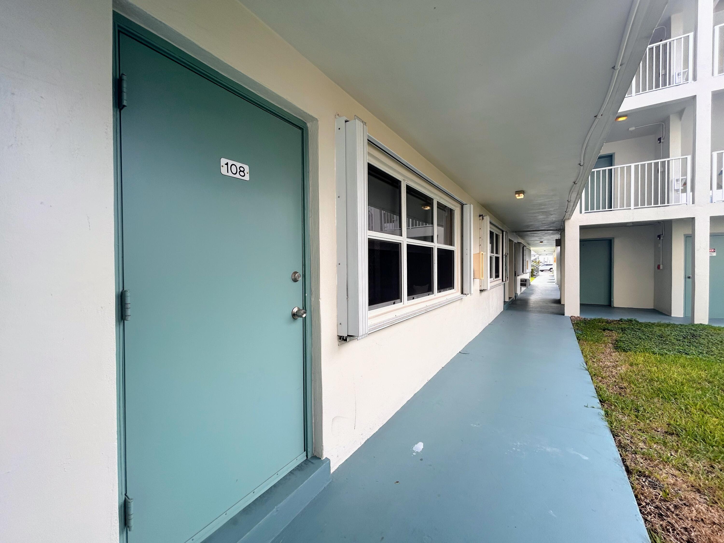 FRONT DOOR W/ ACCORDION SHUTTERS