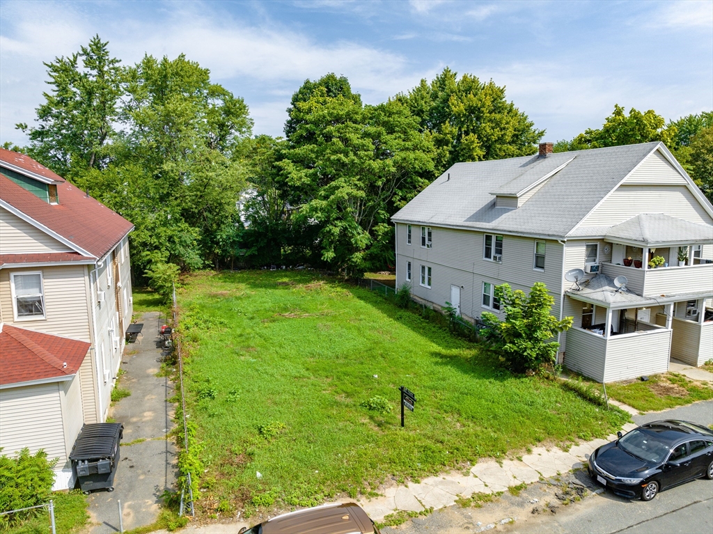 a aerial view of a house with garden and plants