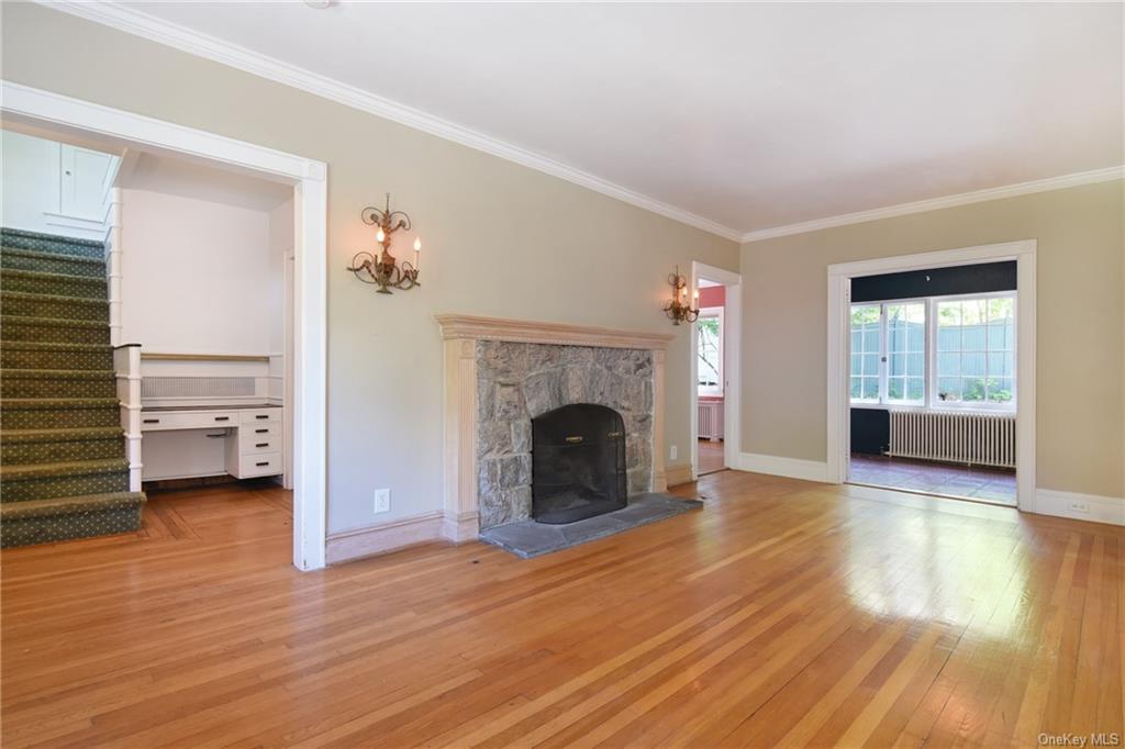 a view of a livingroom with an empty space and a fireplace