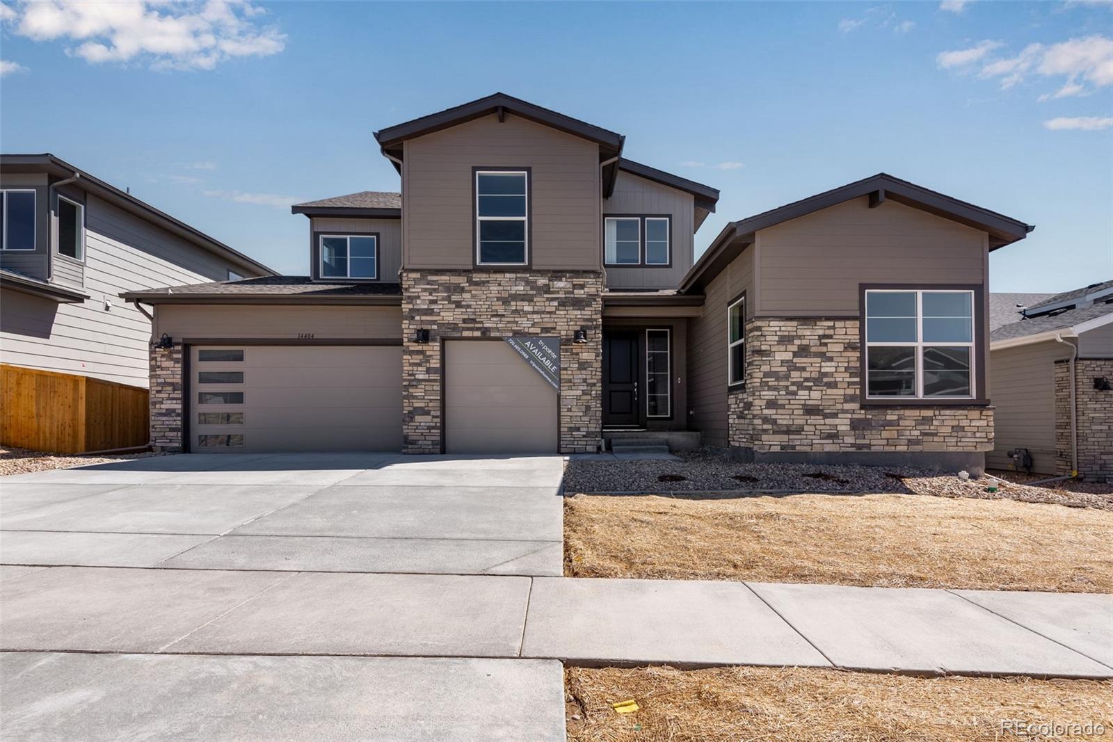 a front view of a house with a garage