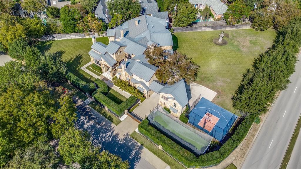 an aerial view of a house with a lake view