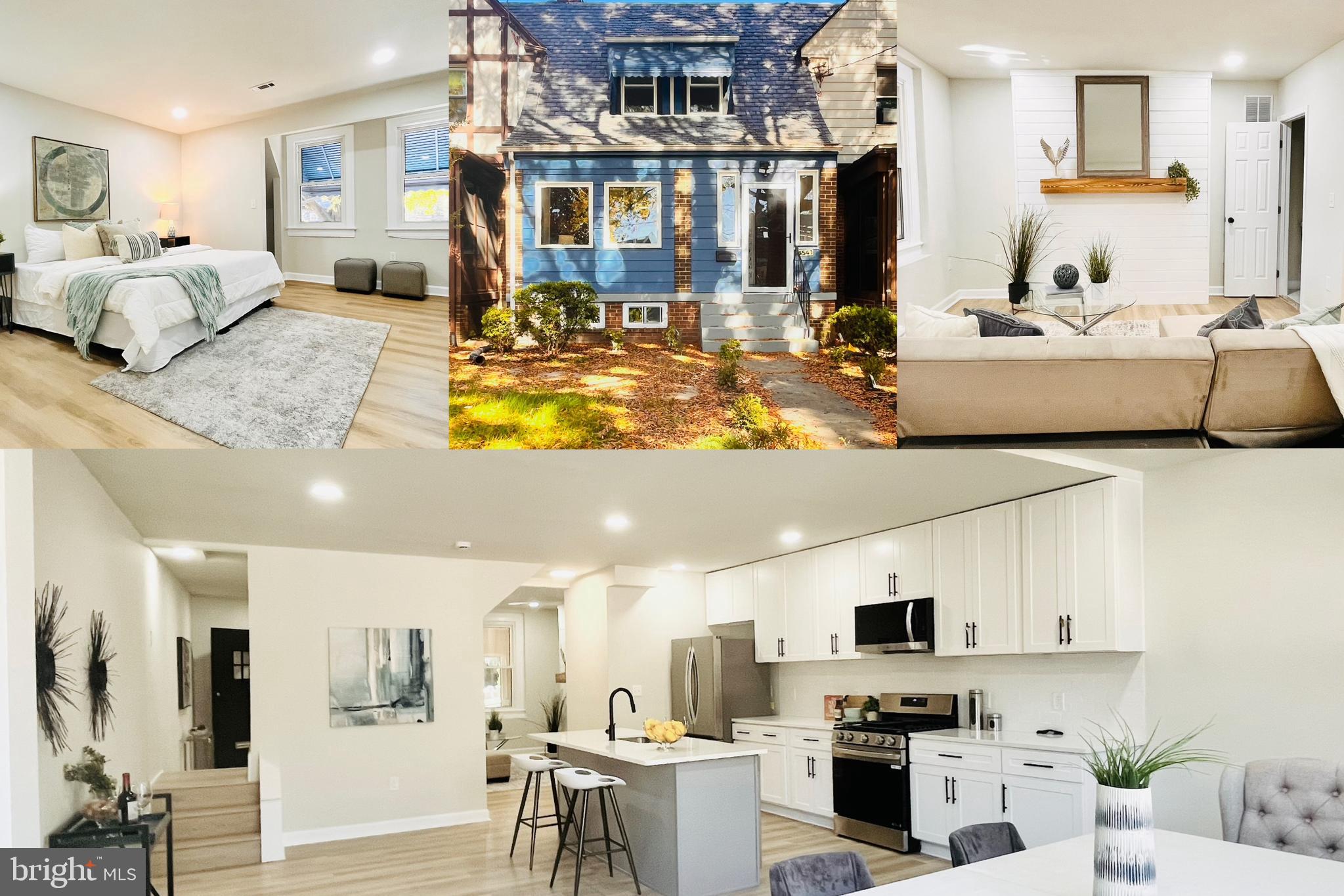 a large white kitchen with stainless steel appliances