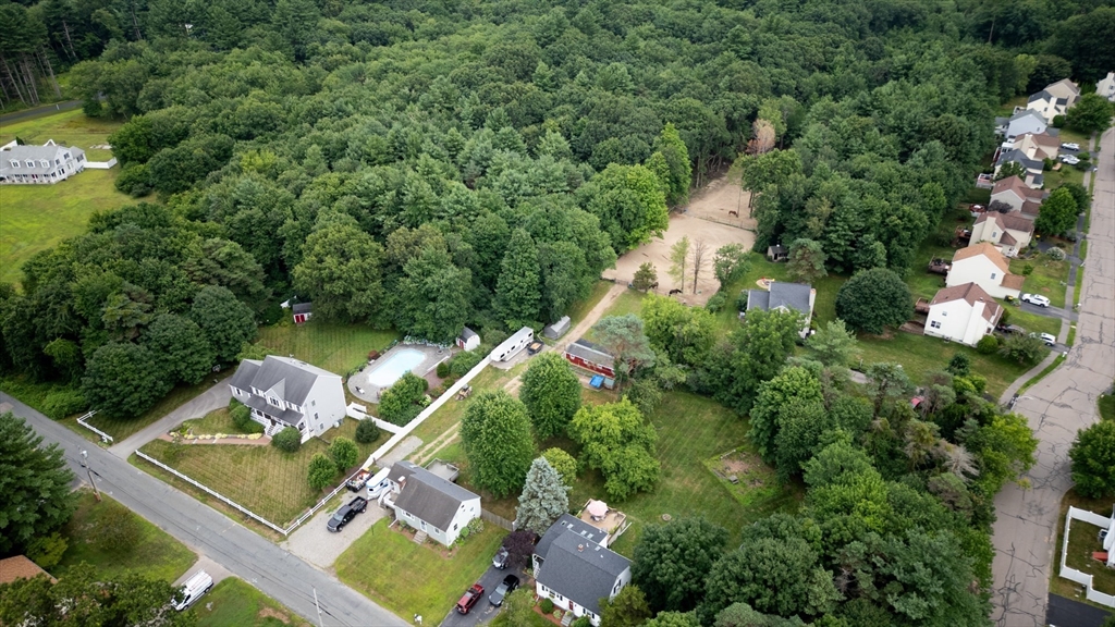 an aerial view of house with yard