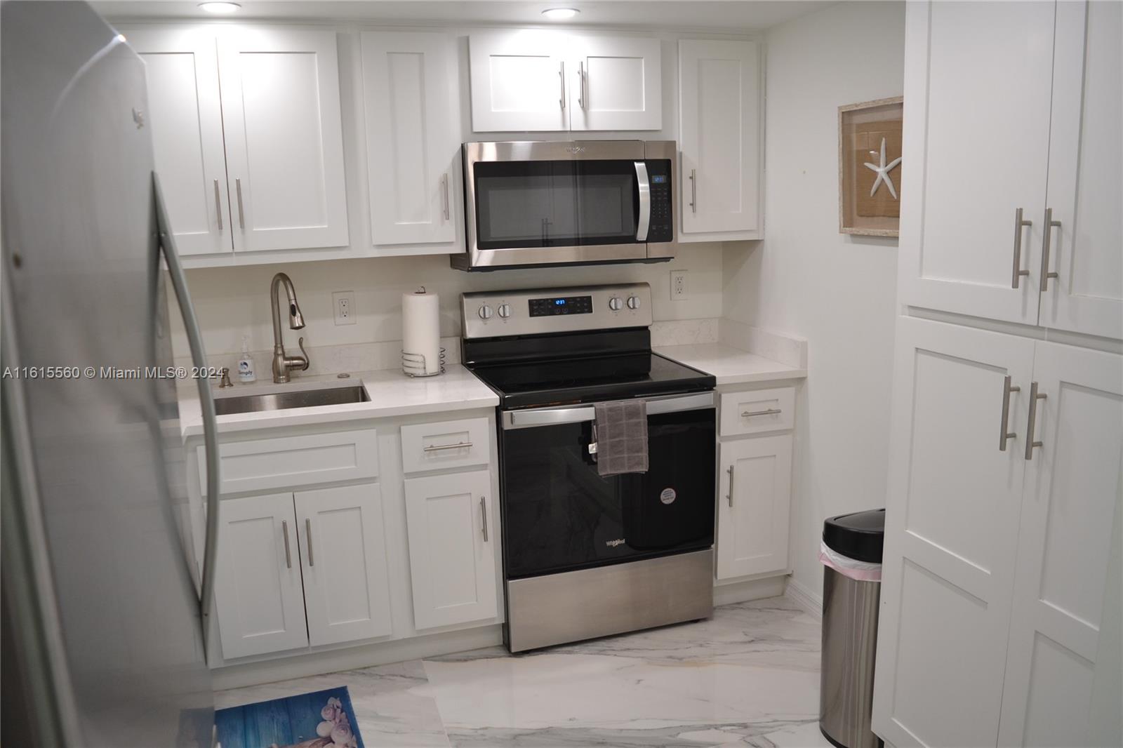 a kitchen with a stove and a microwave