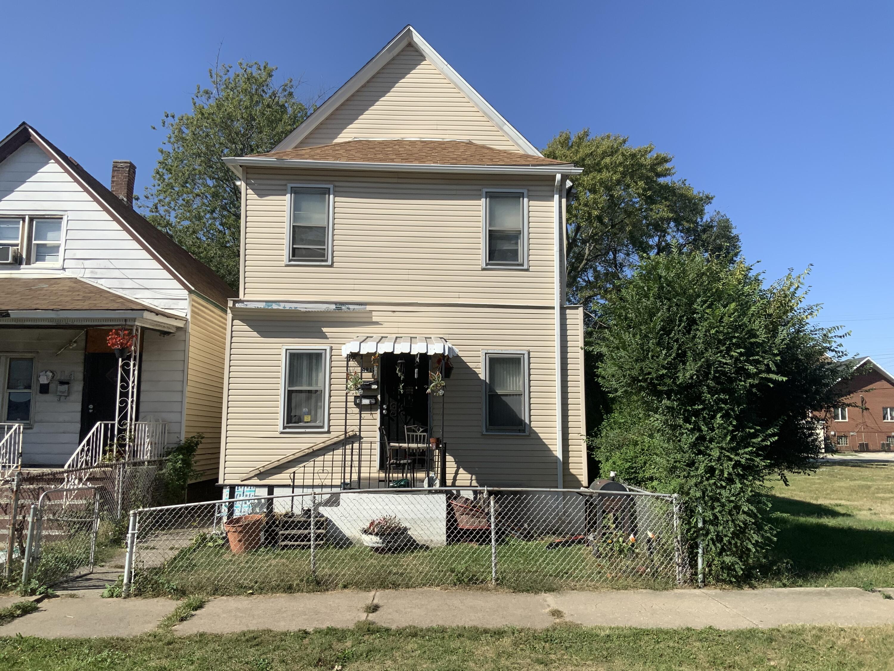 a front view of a house with garage