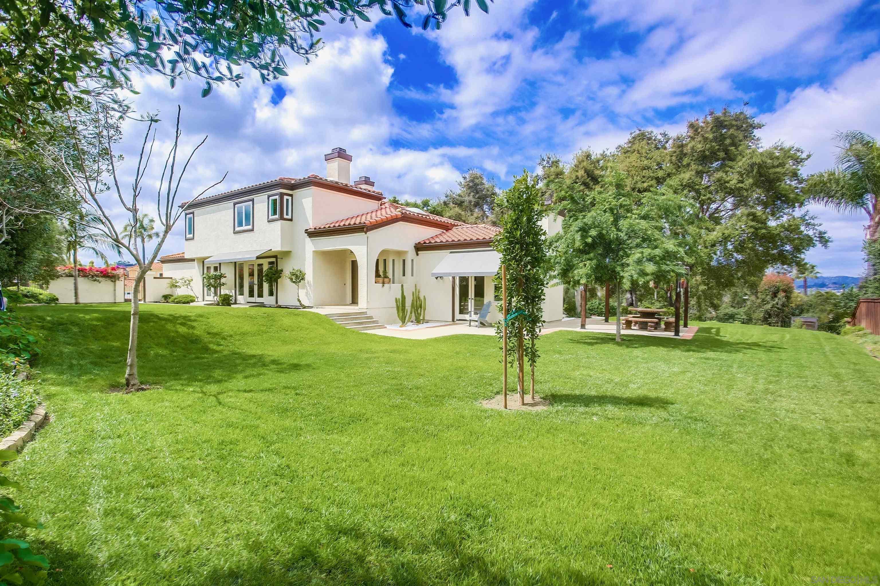 a house with garden in front of it