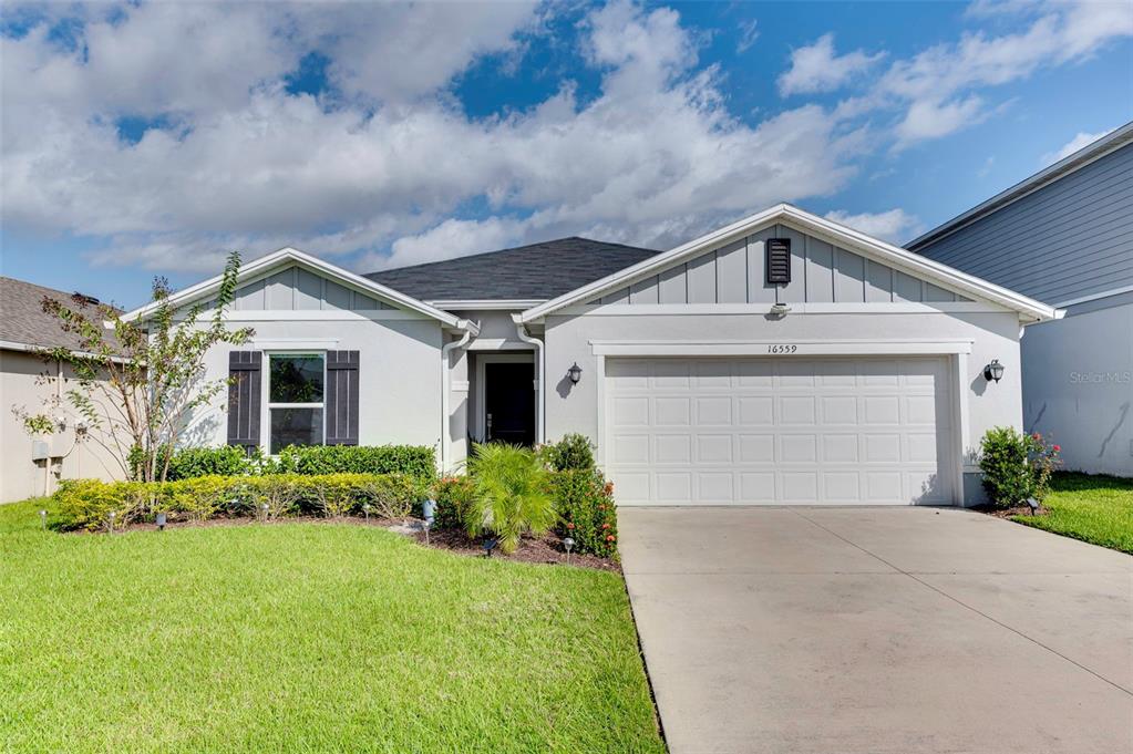 front view of a house with a yard