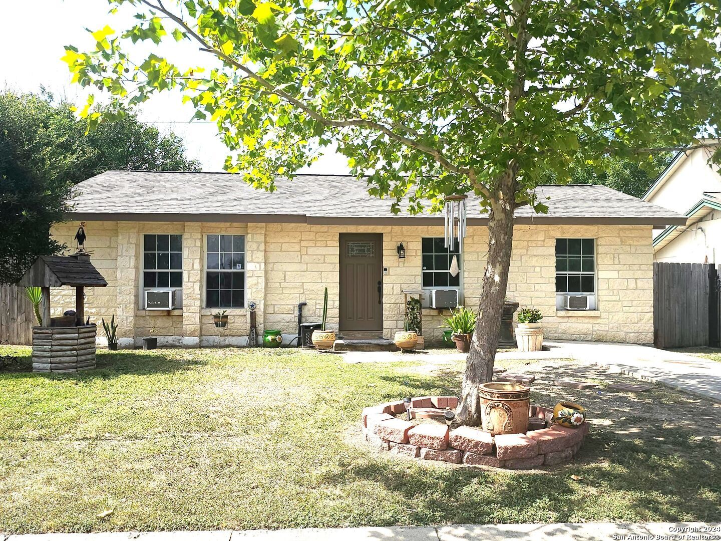 a front view of a house with a yard table and chairs